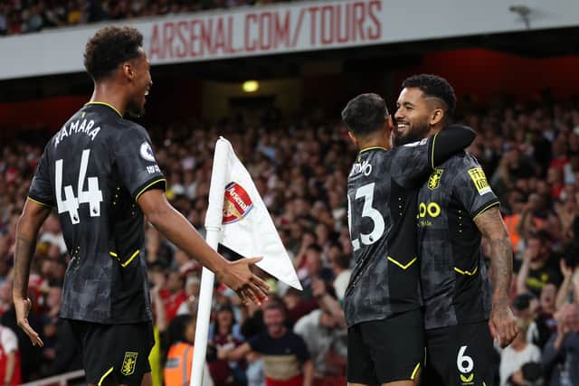 Douglas Luiz of Aston Villa celebrates scoring their side's first goal with teammate Philippe Coutinho and Boubacar Kamara during the Premier League match between Arsenal FC and Aston Villa
