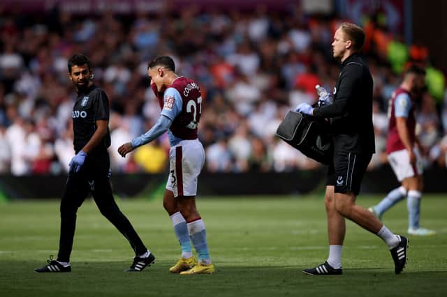 Philippe Coutinho of Aston Villa reacts after suffering an injury during the Premier League match between Aston Villa and West Ham United