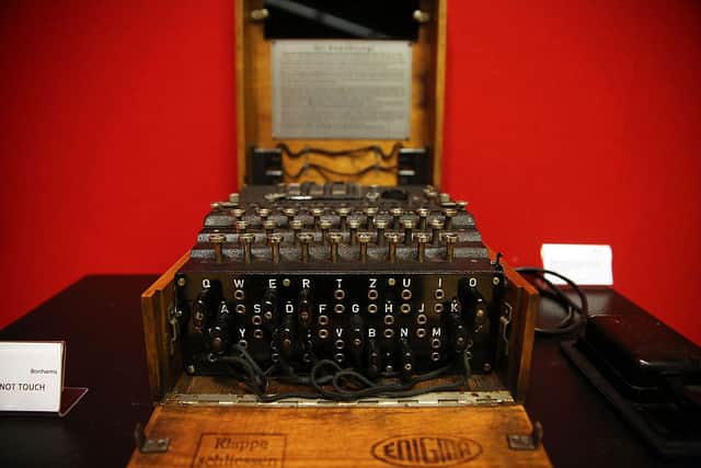 A working Enigma cipher machine that along with the 1942 56-page notebook belonging to codebreaker Alan Turing. (Photo by Spencer Platt/Getty Images)