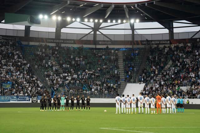 Zurich’s and Arsenal’s players line up during a minute of silence following the announcement of the death of Britain’s Queen Elizabeth II. Credit: URS BUCHER/AFP via Getty Images