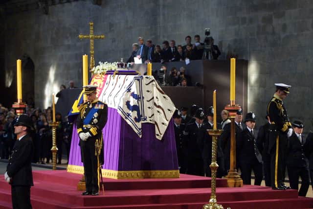 Prince Charles and the Duke of Yor stand vigil beside the Queen Mother’s coffin while it lies-in-state at Westminster Hall in London on 8 April 2002. 