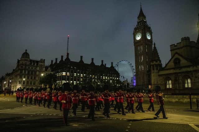 A rehearsal is held early in the morning outside the Houses of Parliament for the ceremonial procession to transfer the coffin of Queen Elizabeth II on September 13, 2022 in London, England. (Photo by Chris J Ratcliffe/Getty Images)