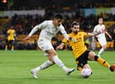 Ruben Neves of Wolverhampton Wanderers makes a sliding challenge on Joao Cancelo of Manchester City the last time the two sides met at Molineux.