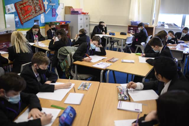 <p>Year 7 students  (Photo by OLI SCARFF / AFP) (Photo by OLI SCARFF/AFP via Getty Images)</p>