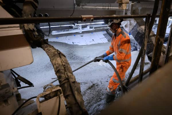 A construction worker works to lay the concrete floor on along a stretch of the HS2 tunnel (Photo by Leon Neal/Getty Images)