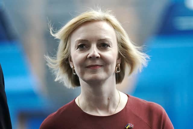 Prime Minister Liz Truss, walks across the Hyatt hotel bridge at the Conservative Party Conference at the ICC in Birmingham
