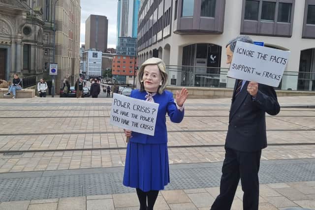 Protestors dress up as Liz Truss and Rees-Mogg