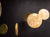 Replicas of the official Nobel Peace Prize gold medal.