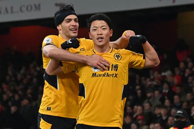 Wolves South Korean striker Hwang Hee-chan (R) celebrates with Wolverhampton Wanderers’ Mexican striker Raul Jimenez  (Photo by GLYN KIRK/AFP via Getty Images)