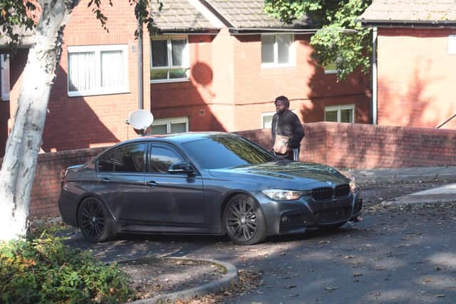 Organised gun criminals Perhys Neale getting into car with Christopher Watson and Shaun Wiliams outside his house
