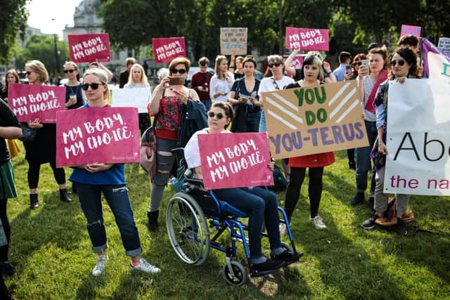 Pro-choice campaigners hold placards outside the Houses of Parliament in 2018  (Photo by Jack Taylor/Getty Images)