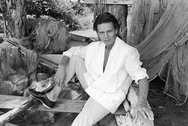 Andy Taylor of the British pop group Duran Duran posing in a dry docked fisherman's boat, probably on location for a video shoot for the album, 'Rio,' c. 1983. (Photo by Express Newspapers/Getty Images)