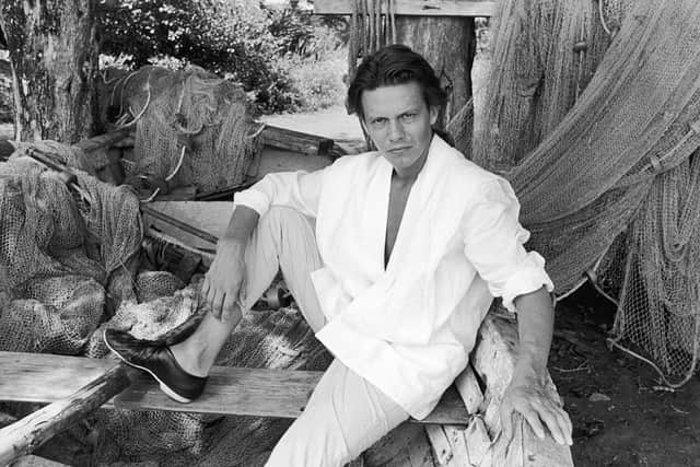 Andy Taylor of the British pop group Duran Duran posing in a dry docked fisherman's boat, probably on location for a video shoot for the album, 'Rio,' c. 1983. (Photo by Express Newspapers/Getty Images) 