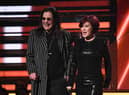 Ozzy Osbourne (L) and wife British television personality Sharon Osbourne (Photo by ROBYN BECK/AFP via Getty Images)