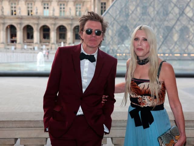  John Taylor (L) and his wife Gela Nash-Taylor   (Photo credit should read GEOFFROY VAN DER HASSELT/AFP via Getty Images)