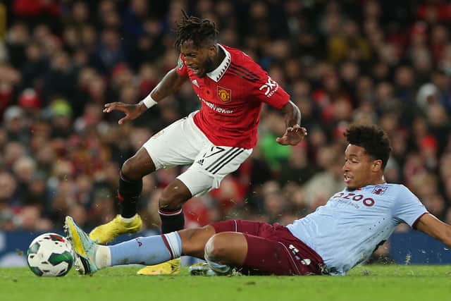 Boubacar Kamara tackles Fred in the Carabao Cup fixture between Manchester United and Aston Villa.