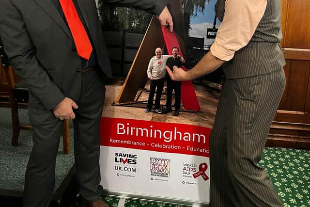 Garry Jones and Luke Perry with a poster for the Birmingham AIDS &HIV Memorial