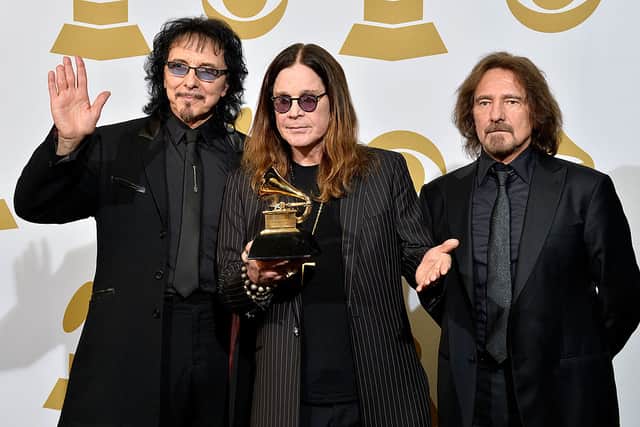 Tony Iommi (L) - his missing fingertips can be seen here (Photo by Frazer Harrison/Getty Images)