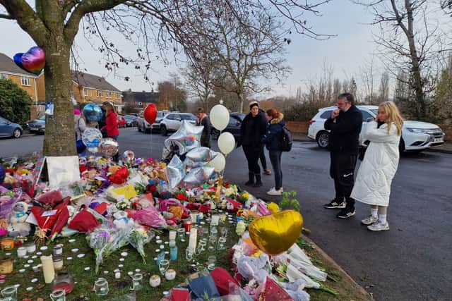 Flowers left near Babbs Mill Lake in Solihull on Tuesday morning (13 December)