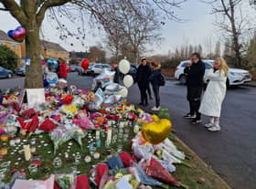 Flowers left near Babbs Mill Lake in Solihull on Tuesday morning (13 December)