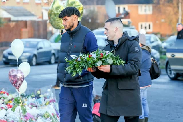 Tyrone Mings and John McGinn of Aston Villa arrive with a floral tribute at Babbs Mill Lake, Kingshurst, Solihull, December 14, 2022 (Photo - Joseph Walshe / SWNS)