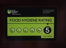 A Food Standards Agency rating sticker on a window of a restaurant 