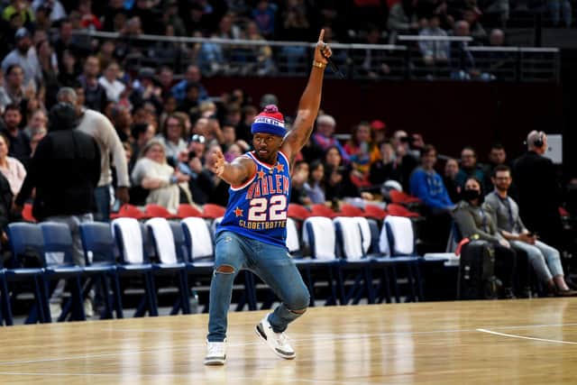 The DJ dances with the crowd during the Harlem Globetrotters Spread Game Tour (Photo by Nathan Hopkins/Getty Images)