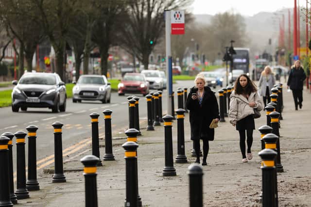 Bollards on the pavement on A 38 in Longbridge in Birmingham used to stop parking near to the school