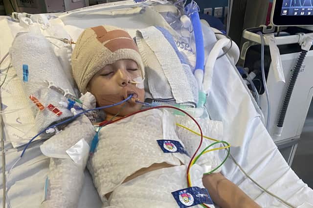 Young Isaiah Jarrett in hospital after brain surgery