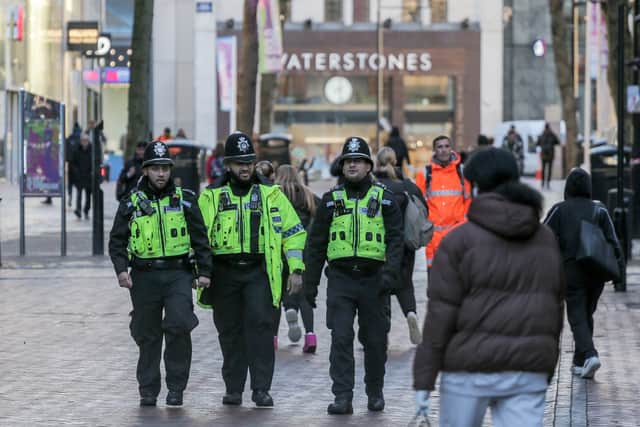 Police near to the scene where a 13-year-old boy has been stabbed outside the McDonalds on the ramp by Stephenson Place in Birmingham City Centre