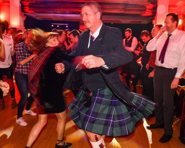 People ceilidh dance during the Burns & Beyond traditional Burns Supper (Photo by Jeff J Mitchell/Getty Images)