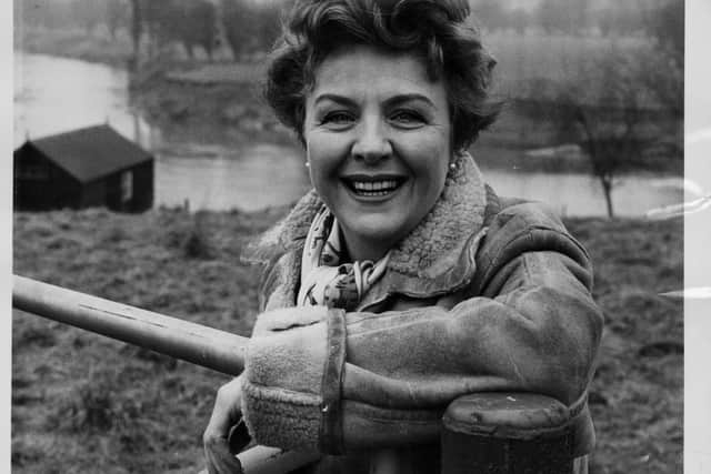 Actress Noele Gordon in the garden of her Hereford home, with the famous salmon fishing river in the background, England, October 29th 1964. (Photo by Fox Photos/Hulton Archive/Getty Images)