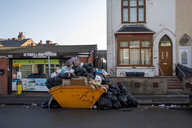 Sladefield Road in Ward End, Birmingham, where a yellow skip has doubled in height of rubbish with everything from building waste to food containers