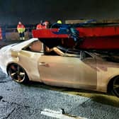 Dramatic images show a white Audi A5 lodged into the back of a HGV on the M6 motorway, between Junction 8 and Junction 9