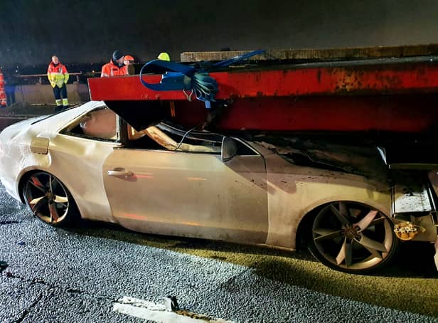Dramatic images show a white Audi A5 lodged into the back of a HGV on the M6 motorway, between Junction 8 and Junction 9