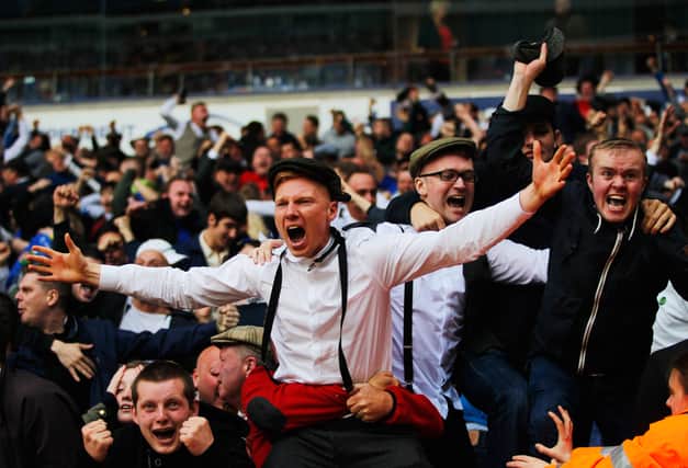 Birmingham City fans celebrate as they avoid relegation after the Sky Bet Championship match between Bolton Wanderers and Birmingham City at Reebok Stadium on May 3, 2014 in Bolton, England.  (Photo by Paul Thomas/Getty Images)