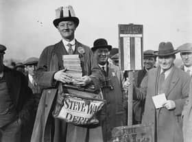 1st November 1926:  Punters queue up to lay their bets at Steve Wall’s bookmaking stand at Birmingham Race Course. The inauguration of a betting tax means that the bookmaker must be well supplied with revenue tickets.  (Photo by Kirby/Topical Press Agency/Getty Images)