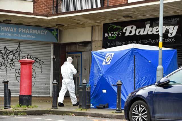 Police and forensic officers at the scene of a violent fatal attack at Heathway Shopping Precinct in Shard End, Birmingham.  (Photo - Emma Trimble / SWNS)