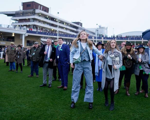 Emotions on show as owners watch their horse on the big screen from the parade ring during day three of the Cheltenham Festival 2023 at Cheltenham Racecourse on March 16, 2023 in Cheltenham, England. (Photo by Alan Crowhurst/Getty Images)