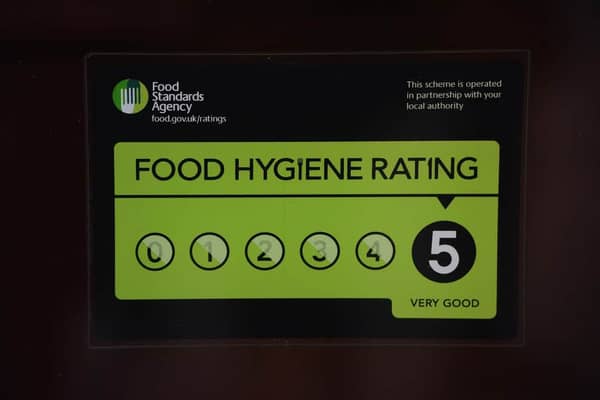 A Food Standards Agency rating sticker on a window of a restaurant in central London. A huge variation in food hygiene standards remains across the UK, with one in five high or medium-risk food outlets failing to meet standards, according to a study