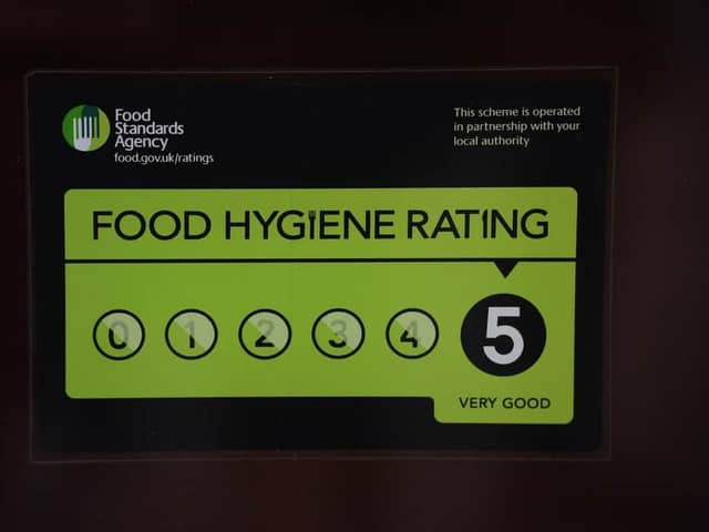 A Food Standards Agency rating sticker on a window of a restaurant in central London. A huge variation in food hygiene standards remains across the UK, with one in five high or medium-risk food outlets failing to meet standards, according to a study