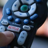 With tough competition from fellow streaming services, Netflix is dedicated to cracking down on password sharing amongst its users (Photo by CHRIS DELMAS/AFP via Getty Images)