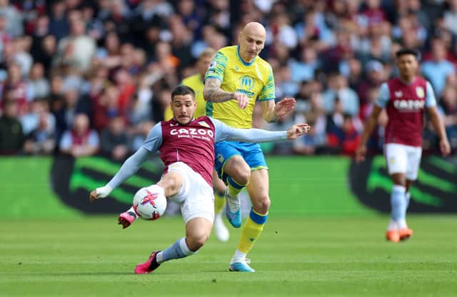 Emi Buendia of Aston Villa is challenged by Jonjo Shelvey of Nottingham Forest during the Premier League match between Aston Villa and Nottingham Forest at Villa Park on April 08, 2023 in Birmingham, England. (Photo by Nathan Stirk/Getty Images)
