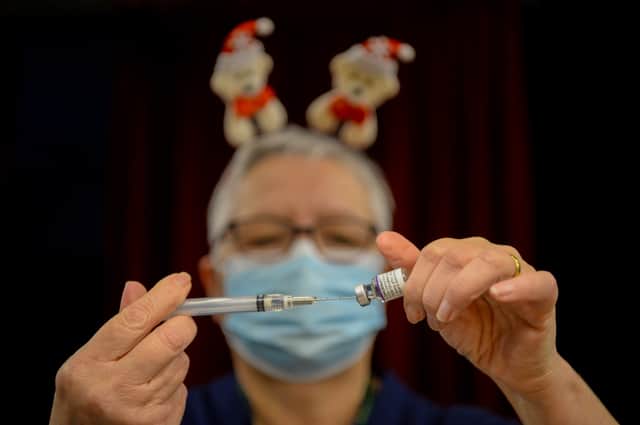Pfizer BioNTech vaccines are prepared at Army Reserve Centre on December 23, 2021 in Poole, England.  (Photo: Getty)