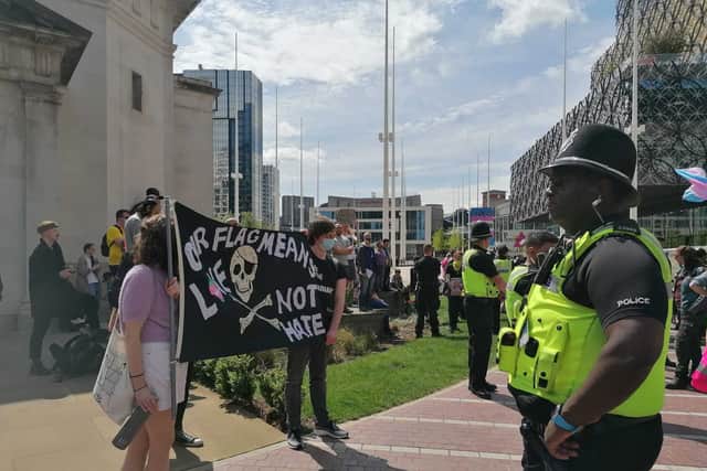 Police and protesters at the Let Women Speak event in Centenary Square on Sunday May 14 2023
