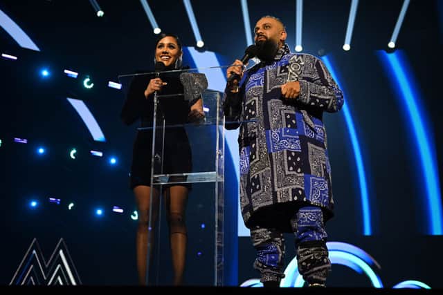 Alex Scott and Guz Khan present the MOBO "Best R&B/Soul Act award at the MOBO Awards 2021 at The Coventry Building Society Arena on December 05, 2021 in Coventry, England. (Photo by Ian Gavan/Getty Images)