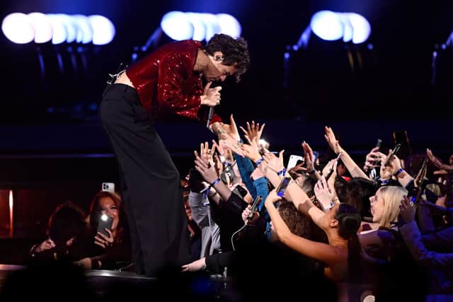 Harry Styles meets fans during his performance  (Photo by Gareth Cattermole/Getty Images)