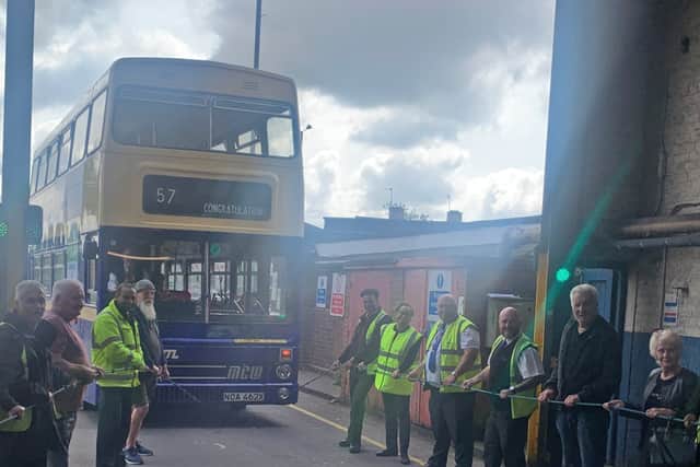 National Express West Midlands colleagues cheer for Birmingham bus driver Bob Smith who retires after 56 years
