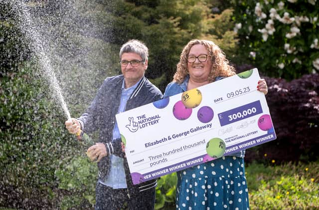 National Lottery winners Liz and George Galloway celebrate after winning Â£300,000 on the National Lottery Bingo Bonus Scratch card in Glasgow. (Photo: Anthony Devlin)