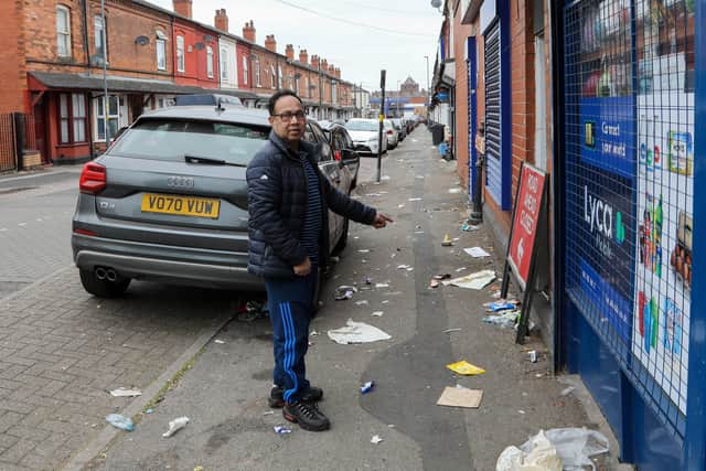 Mr Uddin showing litter on Endicott Road near to Villa Park, home to Aston Villa FC in Birmingham. (Photo - SWNS)
